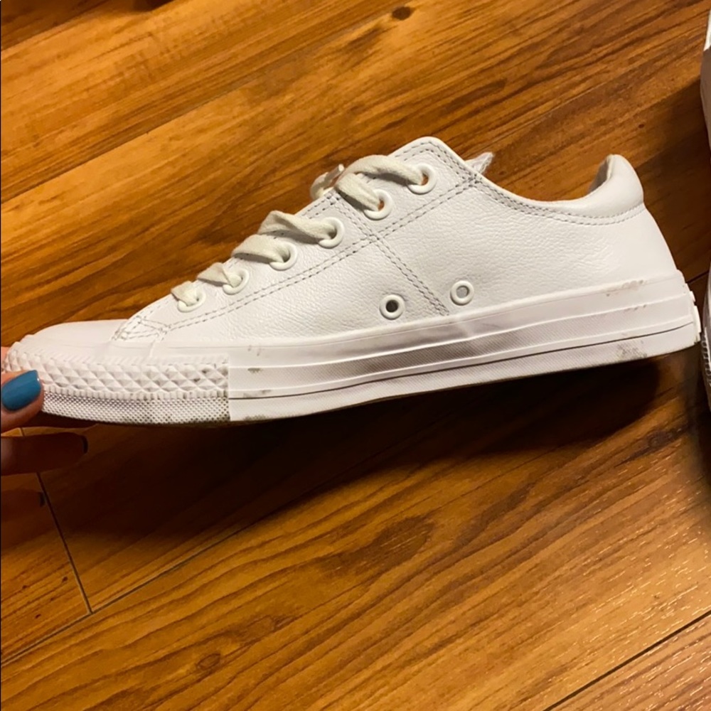 All white leather converse low tops. Size 8